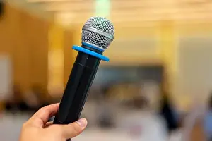 close up wireless mic in the seminar classroom with blur students behind