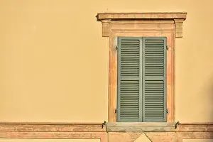 City Prints: Closed green windows on yellow wall of old house in Florence city, Italy