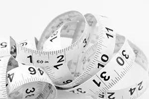Coil Prints: Closeup of coiled measuring tape