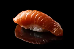 Raw Food Prints: Closeup composition of fresh salmon sashimi sushi isolated on a dark background