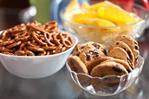 Flavour Prints: Closeup of delicious cookies and pretzels in bowls, with shallow DOF