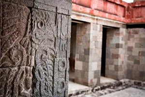 Teotihuacan Prints: A closeup of detailed engravings on a stone pillar in the Palace of Quetzalpapalotl in the Teotihuacan archaeological