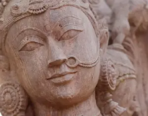 Hyderabad Prints: A closeup of an exquisitely carved granite statue of a woman wearing a nose ring