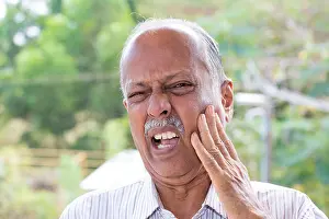 Dental Prints: Closeup portrait elderly business man with tooth ache crown problem cavity grimacing from pain touching outside mouth