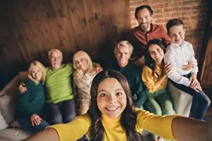 Female Friends Prints: Closeup portrait photo of big full family eight people gathering cuddle embrace small girl daughter make selfie beaming