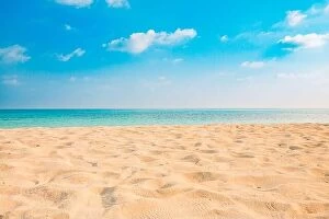 Images Dated 6th January 2017: Closeup of sand on beach and blue summer sky. Panoramic beach landscape