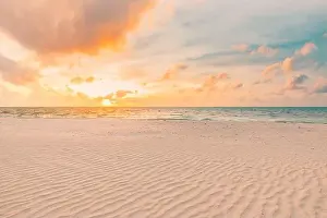 Closeup sea sand beach. Panoramic beach landscape. Inspire tropical beach seascape horizon. Orange and golden sunset sky calmness tranquil relaxing