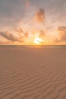 Closeup sea sand beach. Panoramic beach landscape. Inspire tropical beach seascape horizon. Orange and golden sunset sky calmness tranquil relaxing