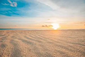 Closeup sea sand beach. Panoramic beach landscape. Inspire tropical beach seascape horizon. Orange and golden sunset sky calmness tranquil relaxing