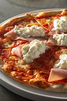 Tomato Sauce Prints: A closeup view of a burrata and prosciutto pizza