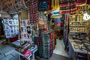 Souk Prints: Clothes and souvenirs shops at Arab market that sprawls across Christian and Moslem Quarters on Old City of Jerusalem