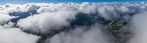 Clouds drift above the mixed evergreen forest covering the Santa Cruz mountains. This part of California is home to Redwood trees and scenic beaches