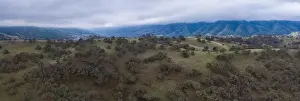 Clouds drift across peaceful green hills and valleys in the tri-valley area in Northern California