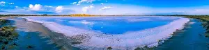 Pink Lake Prints: Clouds reflecting in the salt of lake crosbie in Australian desert - wide aerial panorama