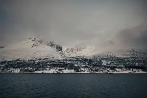 Brim Prints: Clouds over winter mountain view in northern Norway Lyngen Alps