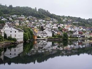 Images Dated 7th July 2017: Cloudy summer view of Hardangerfjord and Norheimsund village, Norway, Europe