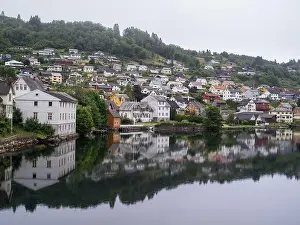 Village House Prints: Cloudy summer view of Hardangerfjord and Norheimsund village, Norway, Europe
