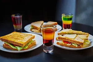 Toast Prints: Club sandwiches & Mexican shots served for party in bar