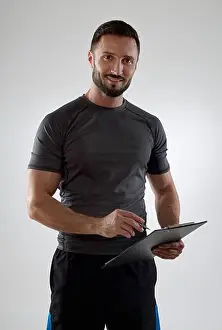 Toughness Prints: Coach with clipboard looking at camera