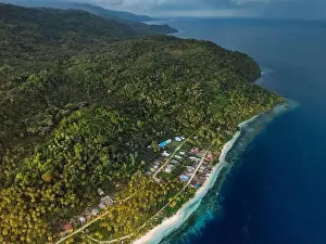 Tropical Paradise Prints: Coastline with mountains, ocean and cloudy weather on scenic island in Indonesia