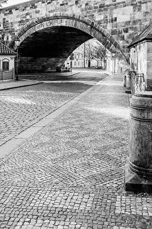 Hiding Prints: Cobbled street under the bridge