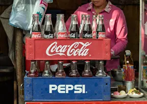 Capitalism Prints: Coca-Cola and Pepsi bottles stacked in plastic container