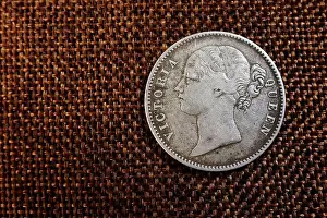 Merchant Prints: The coin showcases a profile of Queen Victoria