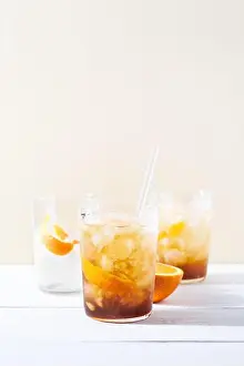 Sparkling Prints: Cold brew coffee mocktail with orange peel and glass straw