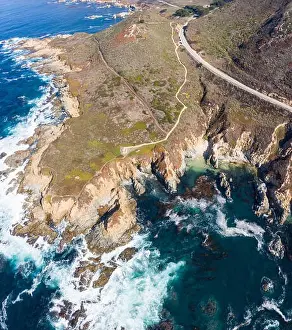 The cold, nutrient-rich waters of the North Pacific Ocean wash against the rocky and scenic coastline of Northern California not far from Monterey