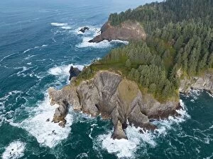 Aerial Landscape Collection: The cold Pacific Ocean washes against the rugged coastline of northern Oregon