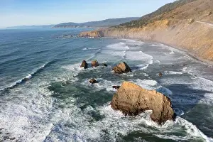 The cold Pacific Ocean washes onto the rugged coastline of Northern California north of Fort Bragg. The Pacific Coast Highway runs along this stretch