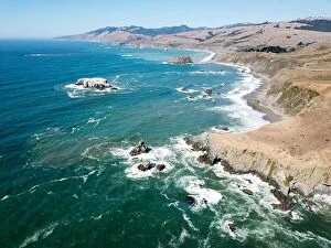 Aerial Landscape Collection: The cold Pacific Ocean washes against the rugged and wild Sonoma coastline in northern California