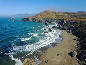 The cold Pacific Ocean washes against the rugged and wild Sonoma coastline in northern California