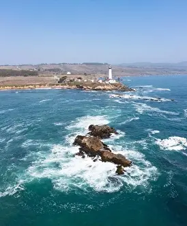 Route 1 Prints: Cold Pacific Ocean waves crash against the rugged