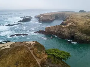 The cold water of the Pacific Ocean washes onto the coast of Mendocino in Northern California. This coastal part of the U.S. is incredibly beautiful
