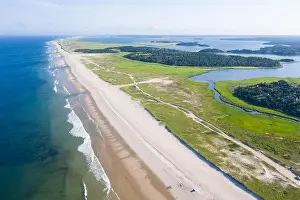 The cold waters of the Atlantic Ocean bathe a scenic beach on Cape Cod, Massachusetts. This beautiful part of New England is a popular vacation area