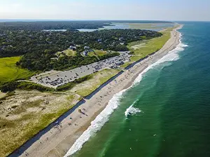 The cold waters of the Atlantic Ocean washes onto Nauset Beach in Orleans, Massachusetts. This beautiful Cape Cod beach is a popular destination