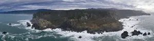 The cold waters of the Pacific Ocean beat against the rocky coastline of Northern California. The Pacific Coast Highway runs along this scenic region