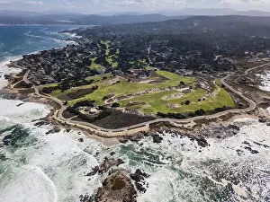 The cold waters of the Pacific Ocean wash against the rocky Northern California coastline in Monterey, just south of San Francisco