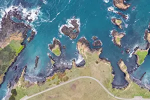 The cold waters of the Pacific Ocean wash against the scenic and rugged Northern California coastline in Mendocino