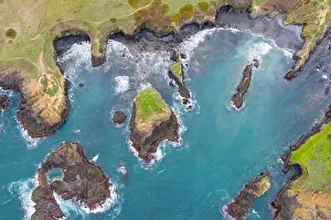 The cold waters of the Pacific Ocean wash against the scenic and rugged Northern California coastline in Mendocino