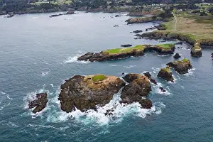 The cold waters of the Pacific Ocean wash against the scenic and rugged Northern California coastline in Mendocino