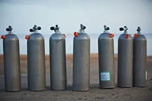 Breathing Prints: Collection of grey scuba diving air oxygen tanks waiting lined up