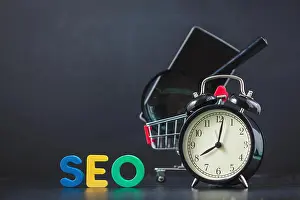 Update Prints: Colored letters of SEO with a magnifying glass