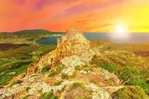 Colorful clouds at sunset sky over Volterraio Castle on rock at 394 m