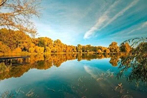 Images Dated 15th October 2017: Colorful foliage tree reflections in calm pond water on a beautiful autumn day
