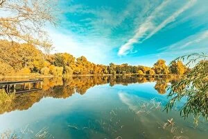Images Dated 15th October 2017: Colorful foliage tree reflections in calm pond water on a beautiful autumn day