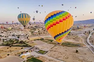 Ballon Prints: Colorful hot air balloons flying over at fairy chimneys valley in Nevsehir