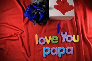 Alphabets Prints: Colorful letters with I love you papa isolated on red cloth background