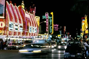 Colorful neon signs at night on Fremont Street in Downtown Las Vegas, Nevada circa 1970s